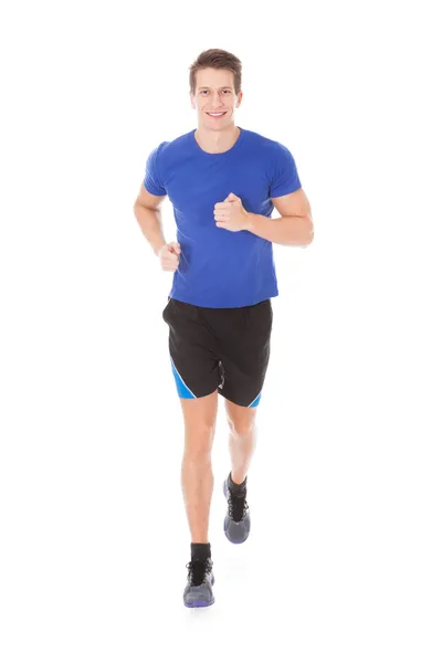 Junger Mann joggt — Stockfoto