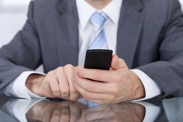 Businessperson Holding Cellphone In Hand — Stock Photo, Image