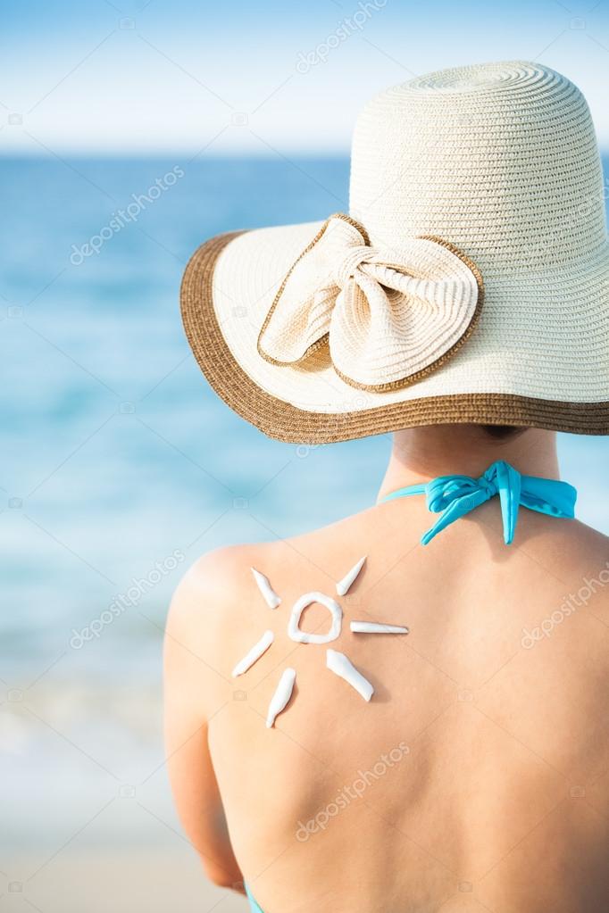 Woman With Sun Drawn From Sunscreen On Back
