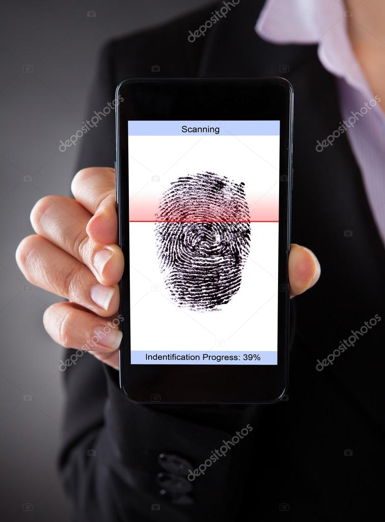 Businessperson With Cellphone Scanning A Fingerprint 