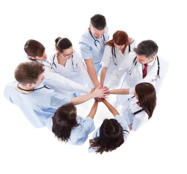 Doctors and nurses stacking hands clipart
