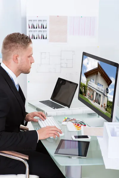 Businessman checking a property portfolio online — Stock Photo, Image