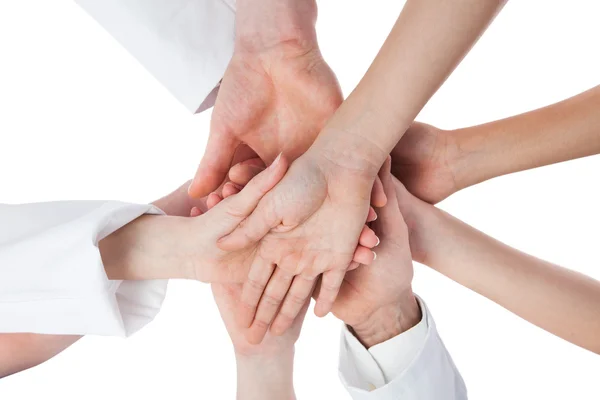 Doctors and nurses stacking hands — Stock Photo, Image