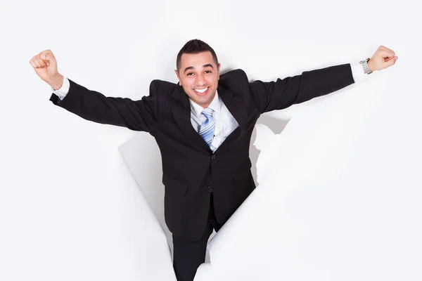 Successful Businessman Breaking Through White Wall — Stock Photo, Image