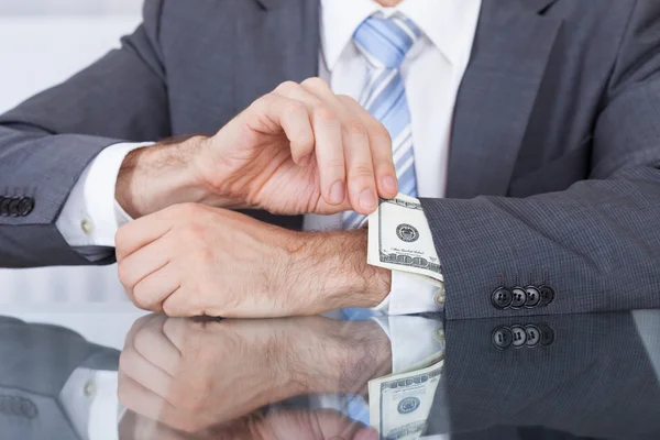 Businessperson Removing Bank Note From Sleeve — Stock Photo, Image