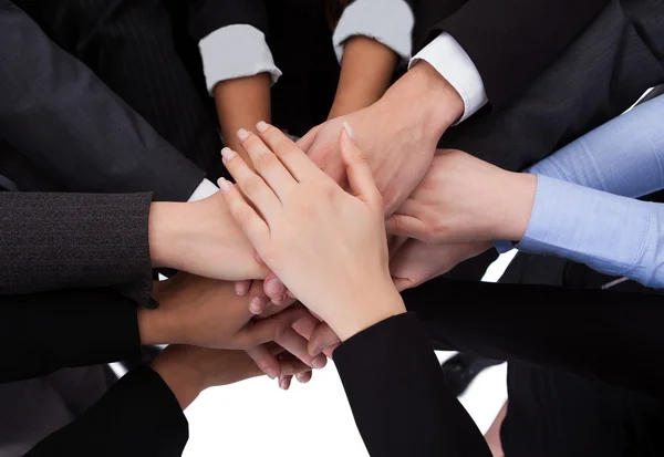 Business people stacking hands Stock Photo