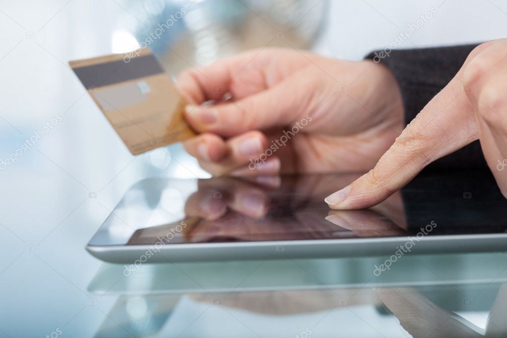 Woman With Credit Card Shopping Online