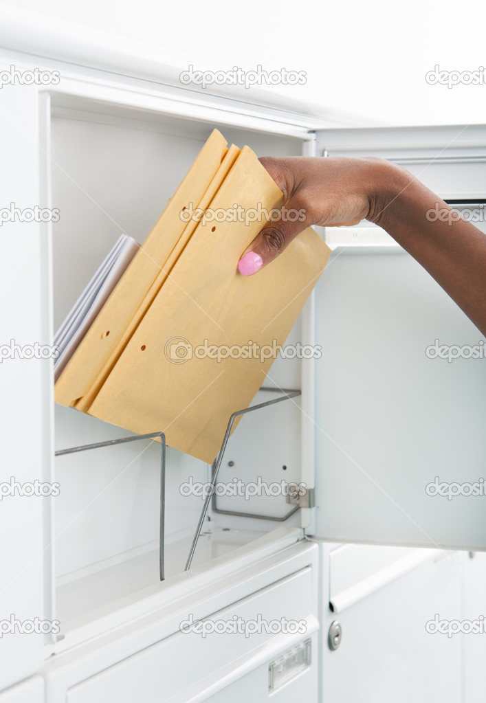 Woman Getting Letters From Mailbox