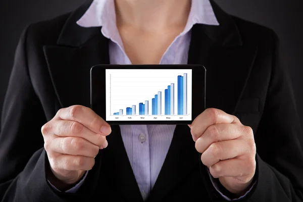 Businessperson Showing Graph On Cellphone — Stock Photo, Image