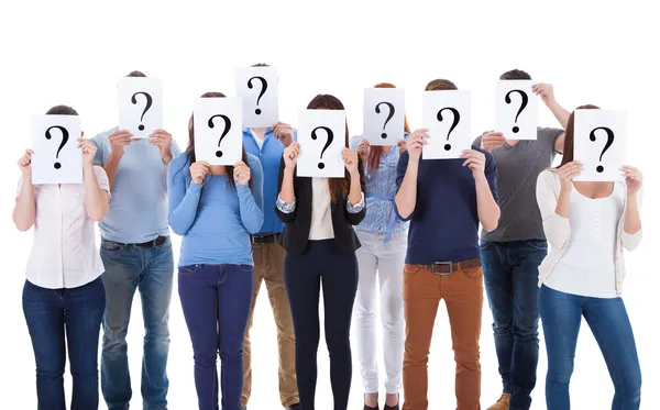 Diverse group of people holding question signs — Stock Photo, Image