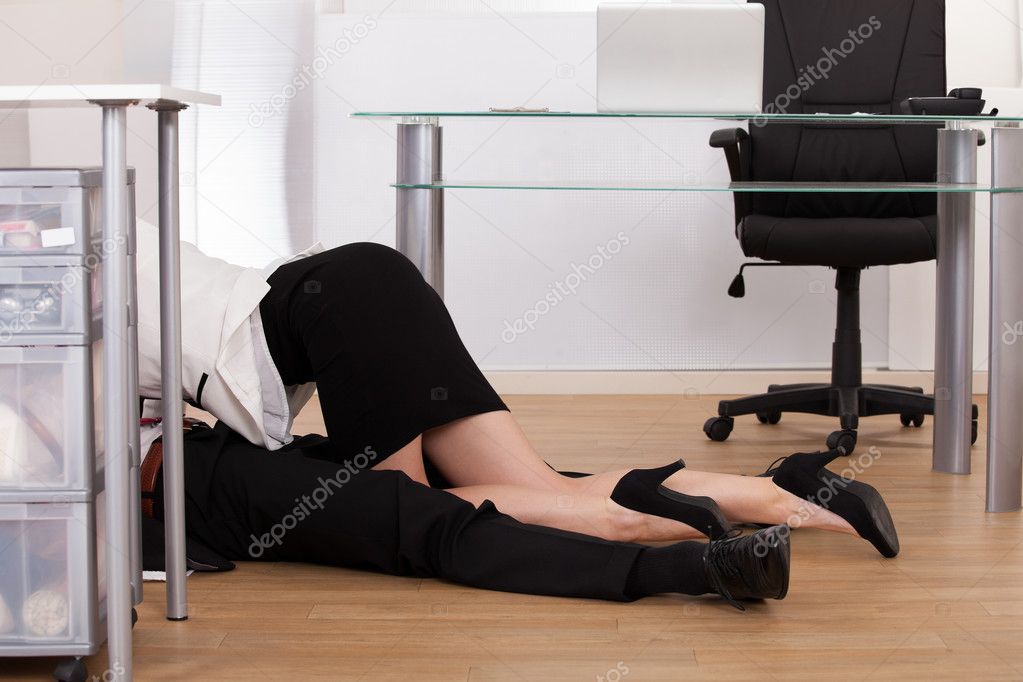 Low Section Of Business Couple Getting Intimate On Floor