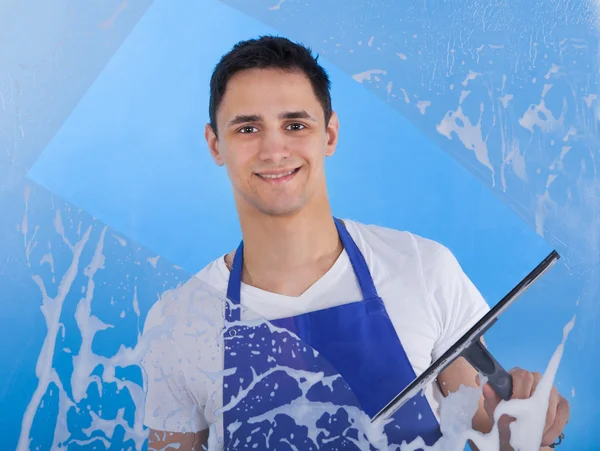 Male Servant Cleaning Glass With Squeegee — Stockfoto