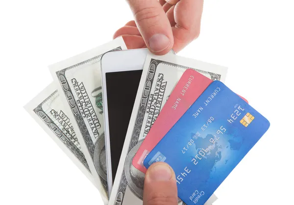 Hand holding banknotes credit cards and a tablet — Stock Photo, Image