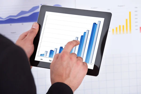 Businessman Analyzing Bar Graph On Digital Tablet — Stock Photo, Image