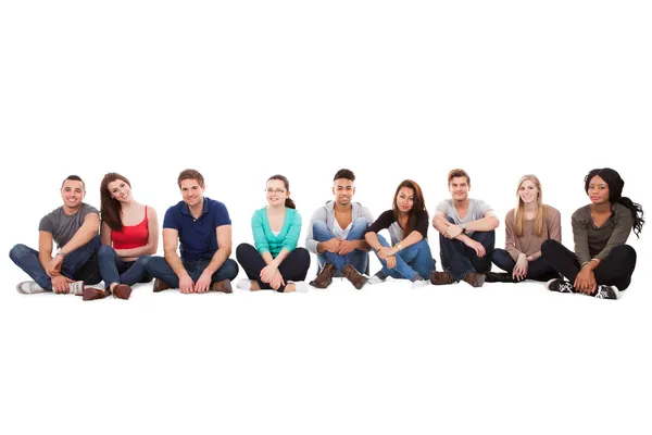 Multiethnic College Students Sitting In A Row — Stock Photo, Image