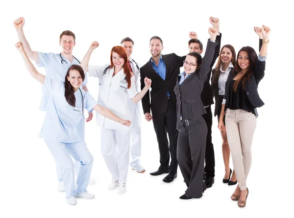 Doctors and managers raising arms — Stock Photo, Image
