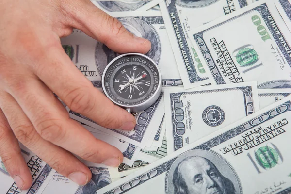 Hand Holding Compass On Us Currency — Stock Photo, Image