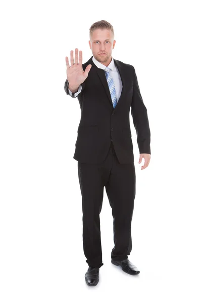 Businessman holding up his hand in a stop gesture — Stock Photo, Image