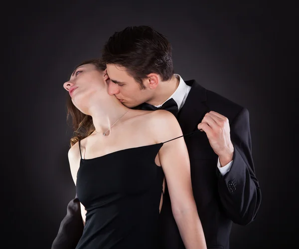 Man Kissing Woman On Neck While Removing Dress Strap — Stock Photo, Image