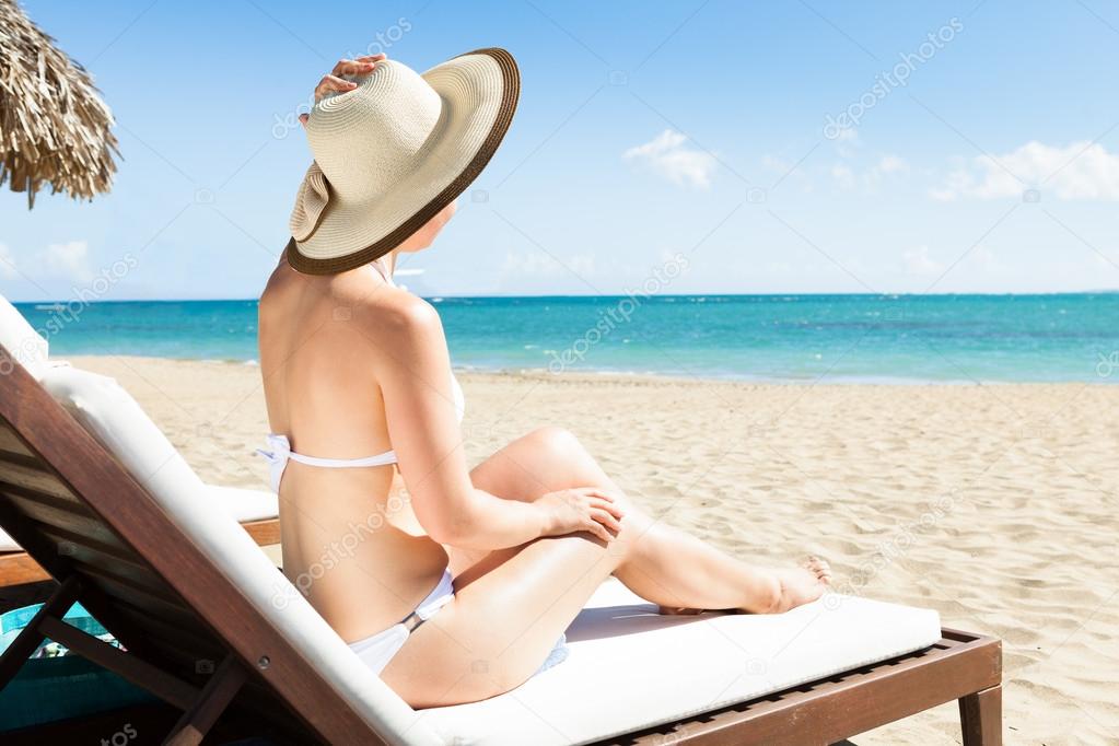 Young woman in bikini enjoying the ocean view