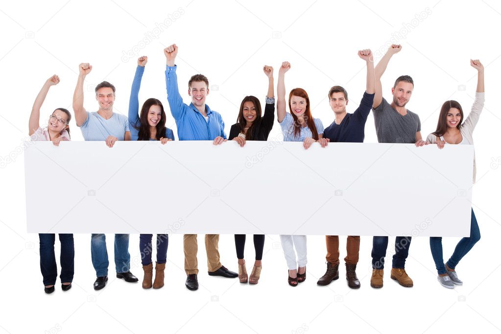 Excited group of diverse people holding banner