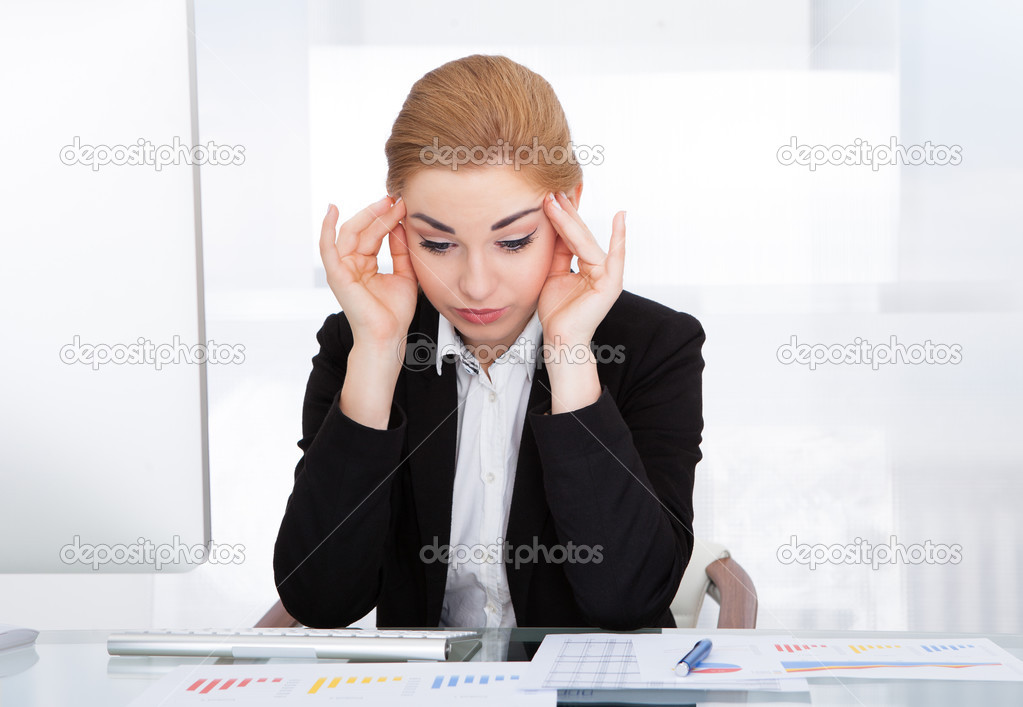 Businesswoman Suffering From Headache