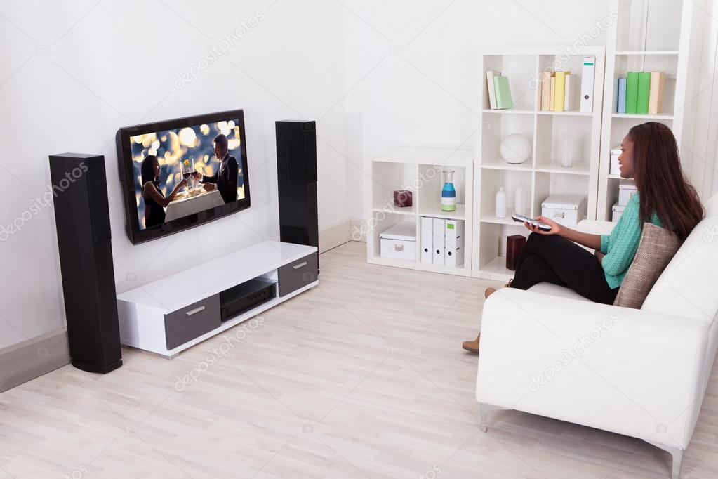 Woman Watching TV In Living Room