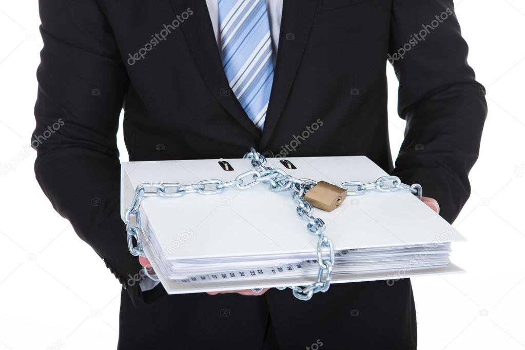 Businessman holding a top secret file