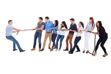 Group of people having a tug of war clipart