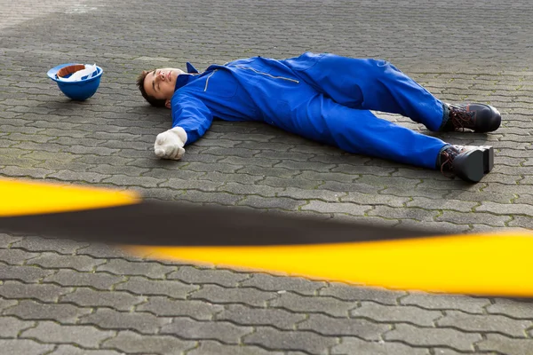 Young Unconscious Technician Lying On Street — Stock Photo, Image