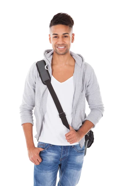 Bello studente che trasporta borsa a tracolla — Foto Stock