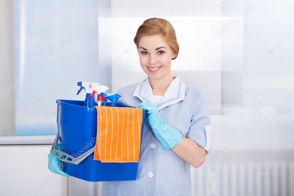 Young Maid Holding Cleaning Supplies