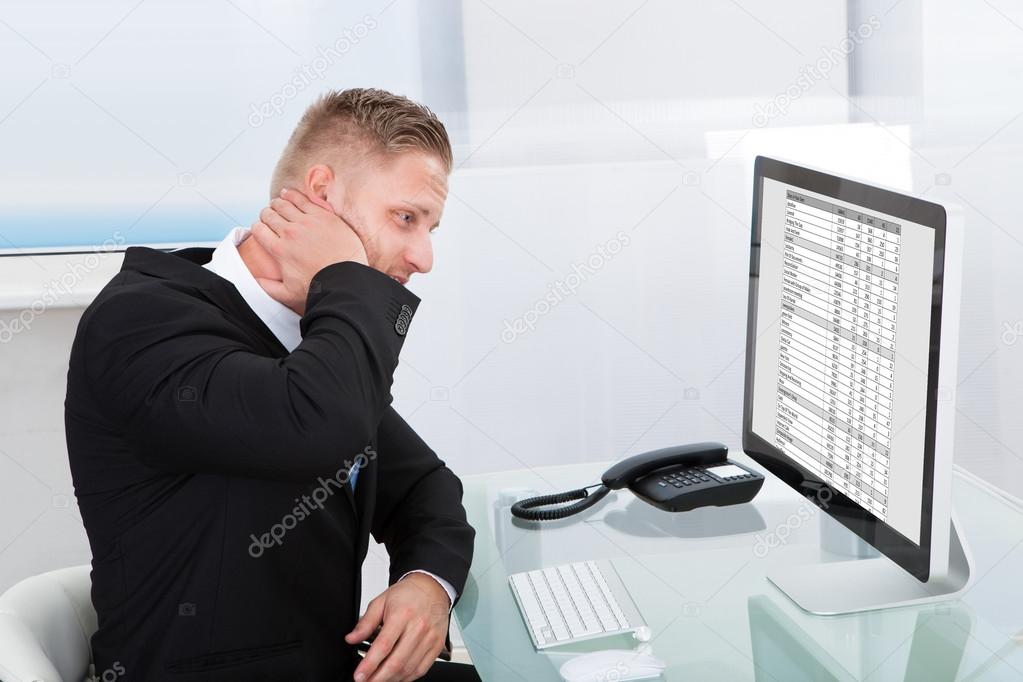 Businessman studying an online spreadsheet