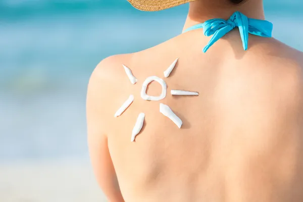 Woman With Sun Drawn From Sunscreen On Back — Stock Photo, Image