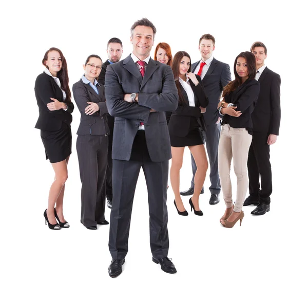 Senior business manager standing on front of his team — Stock Photo, Image