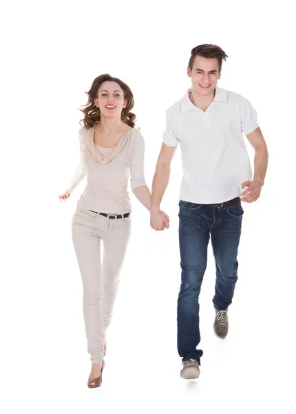 Paar in casuals wandelen op witte achtergrond — Stockfoto