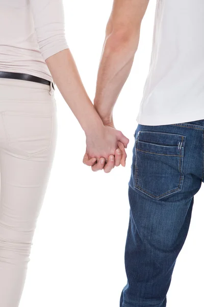 Imagem cortada de casal segurando as mãos sobre fundo branco — Fotografia de Stock