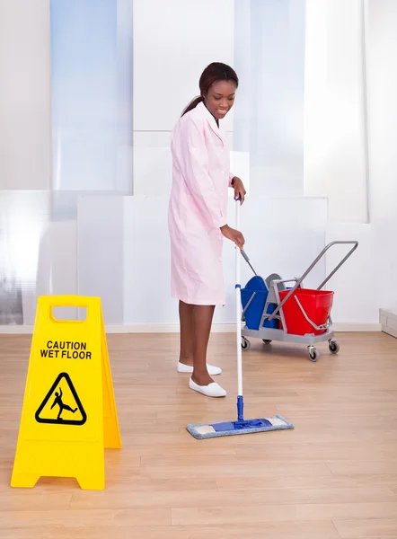 Female Housekeeper Cleaning Floor In Hotel — Stock Photo, Image