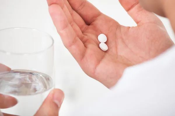 Man Taking Pills With Glass Of Water — Stock Photo, Image