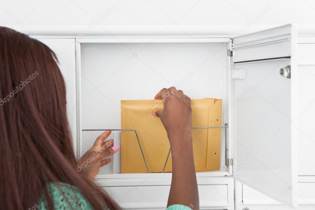 Woman Getting Letters From Mailbox