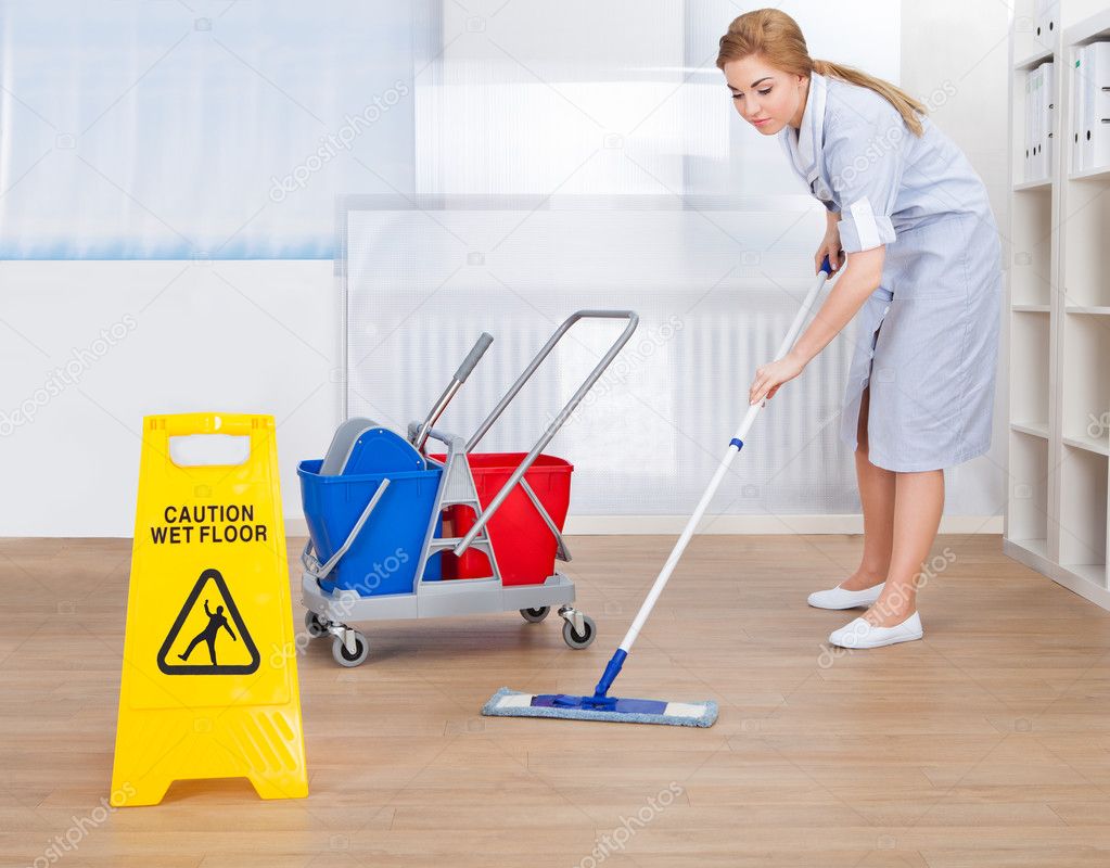 Happy Maid Cleaning Floor With Mop