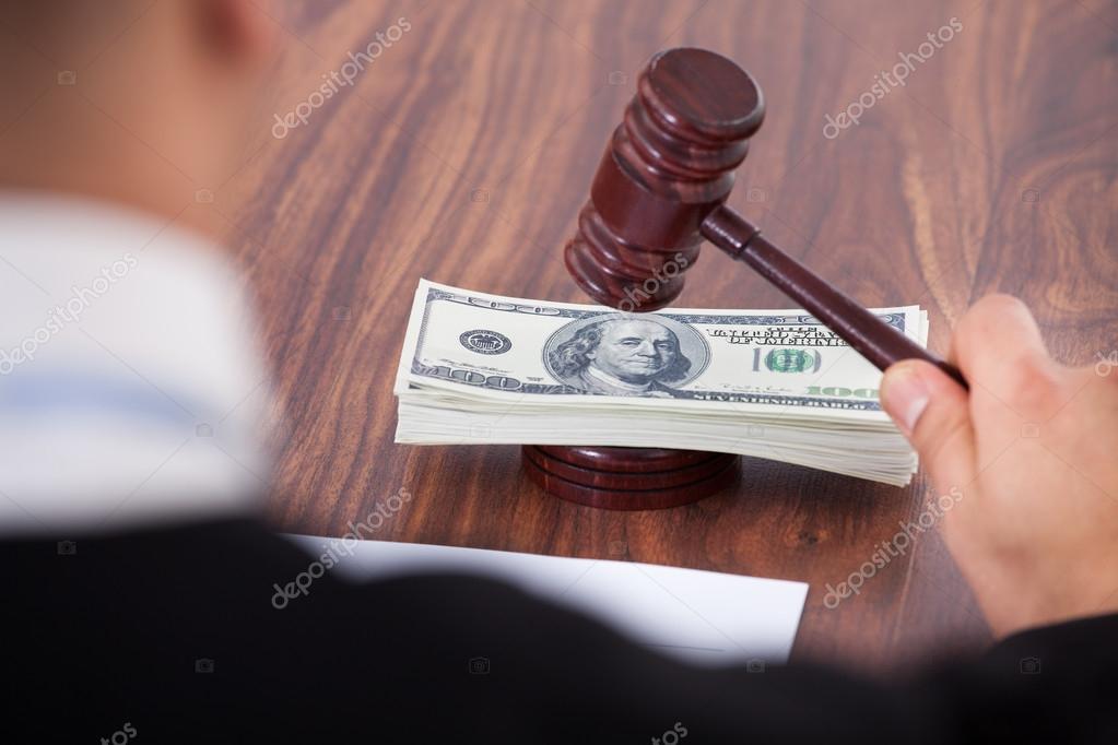 Judge Hitting Mallet On Banknotes Stock Photo by ©AndreyPopov 44071489