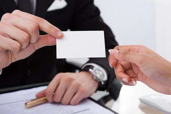 Businessman Giving Business Card To Colleague — Stock Photo, Image