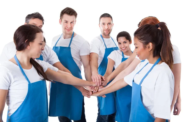 Cleaners stacking hands — Stock Photo, Image