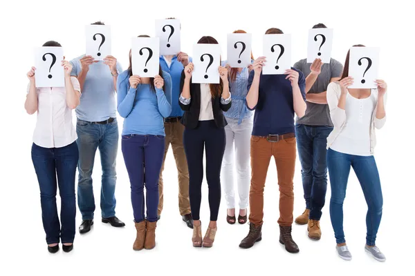 Diverse group of people holding question signs — Stock Photo, Image