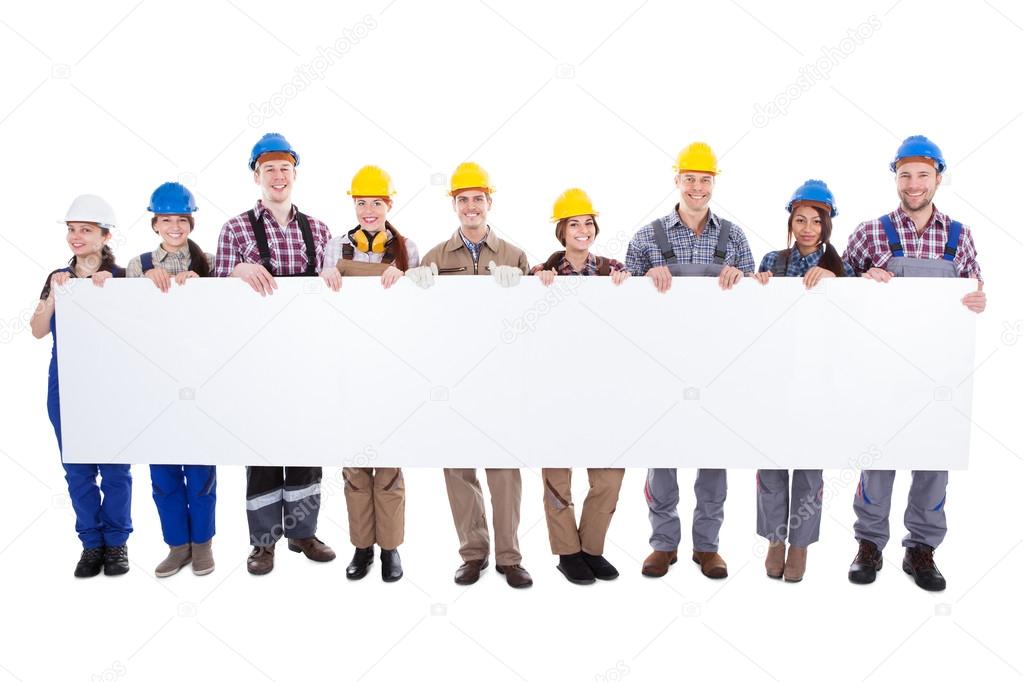 Group of workmen and women with a banner