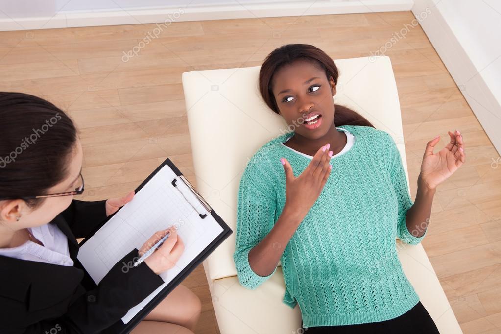 Female Patient Conversing With Psychologist