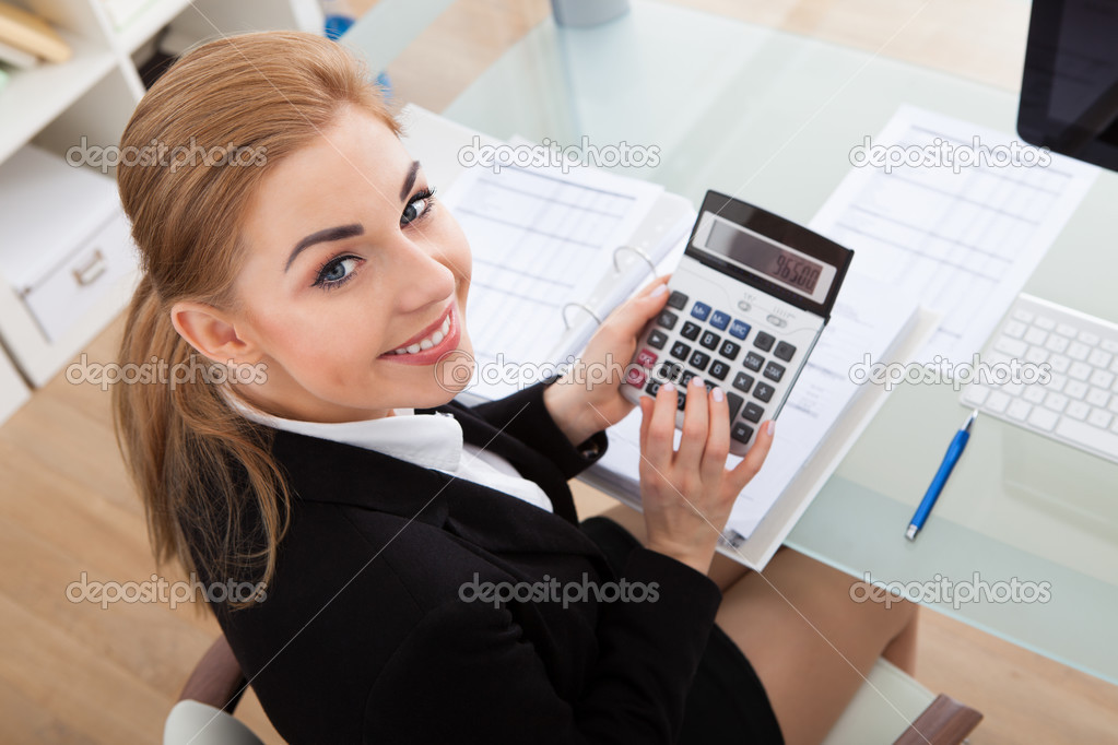 Young Businesswoman Working At Desk