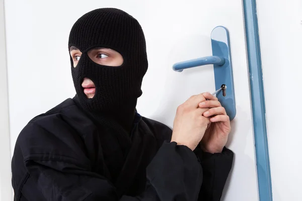 Thief Opening Door With Tool During House Breaking — Stock Photo, Image