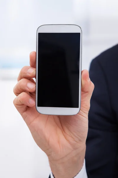 Businessman Showing Smartphone — Stock Photo, Image
